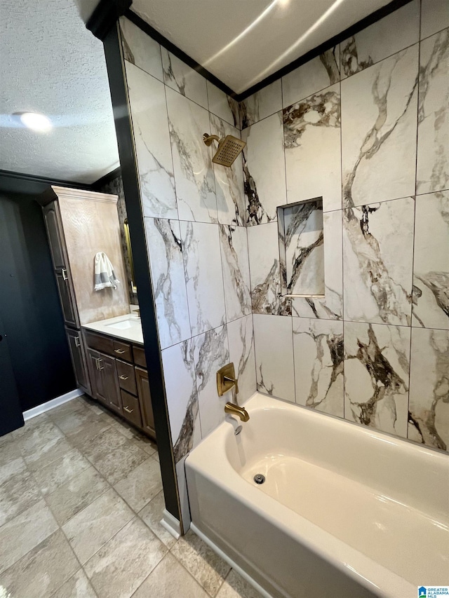 bathroom with a textured ceiling, vanity, shower / washtub combination, and tile walls