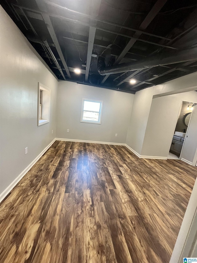 basement featuring dark hardwood / wood-style floors