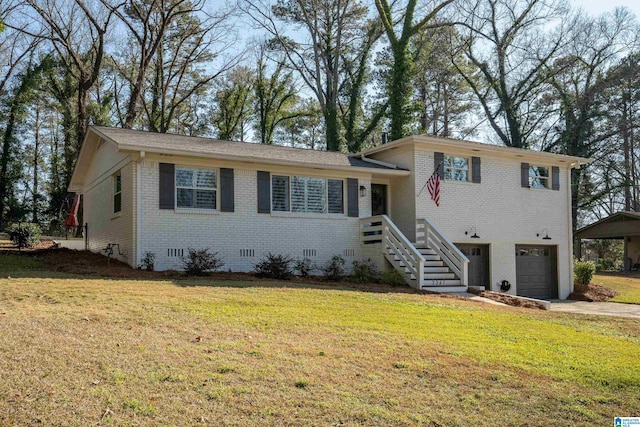 tri-level home with a garage and a front lawn