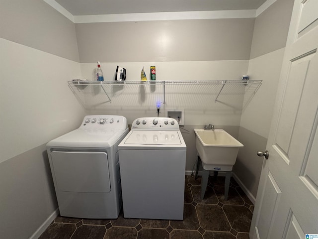 laundry room with washing machine and dryer and sink