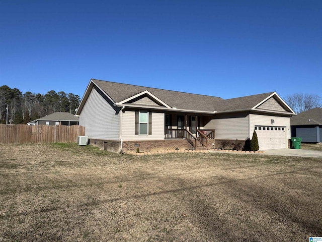 view of front of property featuring a front yard, covered porch, a garage, and cooling unit