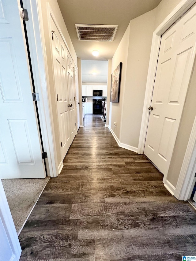 hall featuring dark hardwood / wood-style flooring