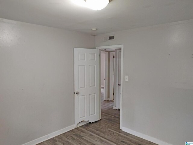 empty room with hardwood / wood-style floors