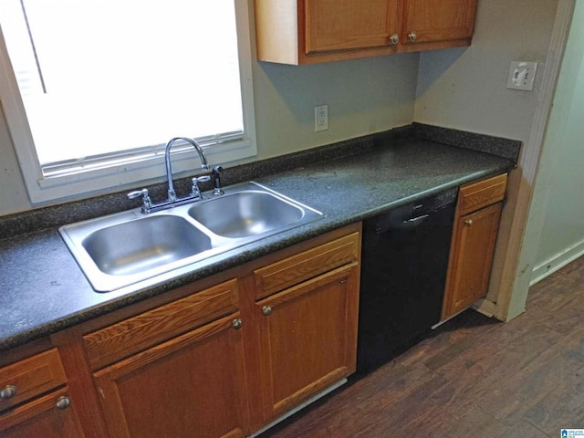 kitchen with sink, black dishwasher, and dark wood-type flooring