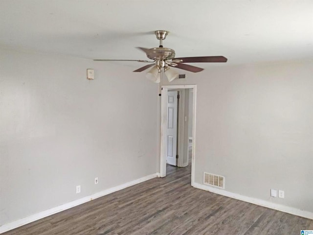 empty room featuring dark hardwood / wood-style floors and ceiling fan