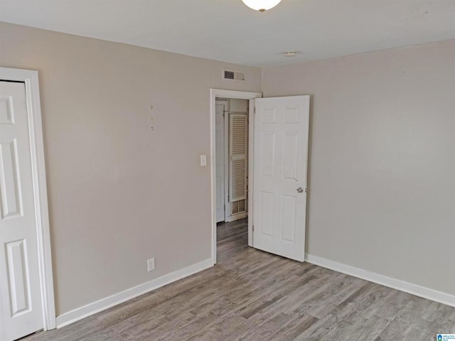 unfurnished bedroom featuring light wood-type flooring