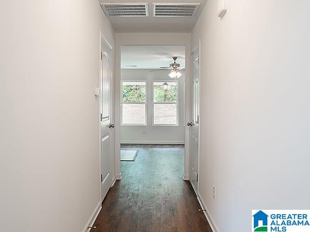 hallway featuring dark hardwood / wood-style floors