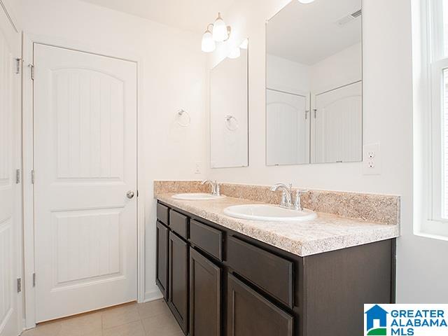 bathroom with vanity and tile patterned floors