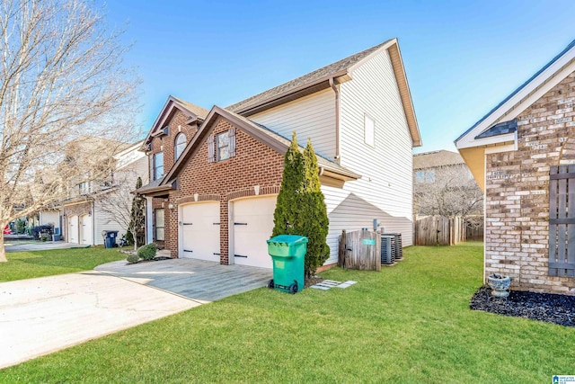 view of home's exterior featuring central AC, a garage, and a lawn