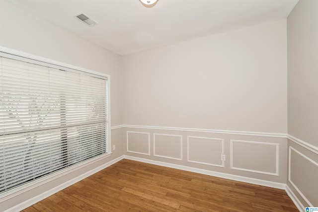 spare room featuring hardwood / wood-style floors