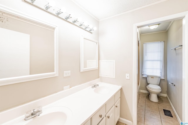 bathroom featuring tile patterned flooring, a textured ceiling, toilet, vanity, and ornamental molding