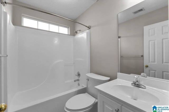 full bathroom with vanity, toilet, a textured ceiling, and shower / washtub combination