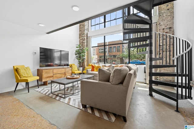 living room with a towering ceiling