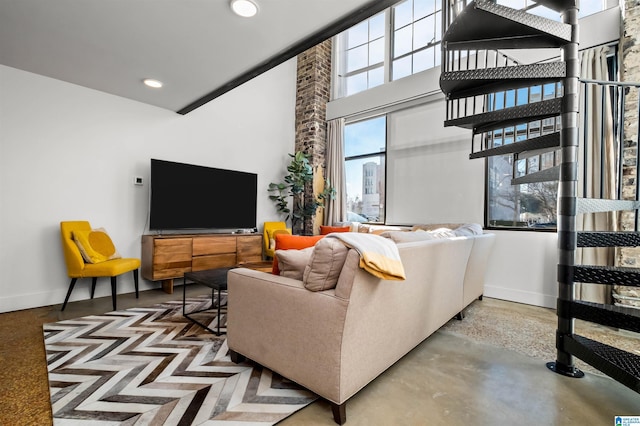 living room featuring concrete flooring