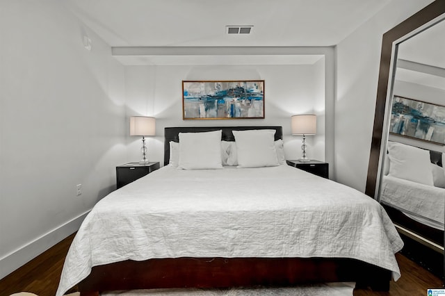 bedroom featuring dark hardwood / wood-style flooring