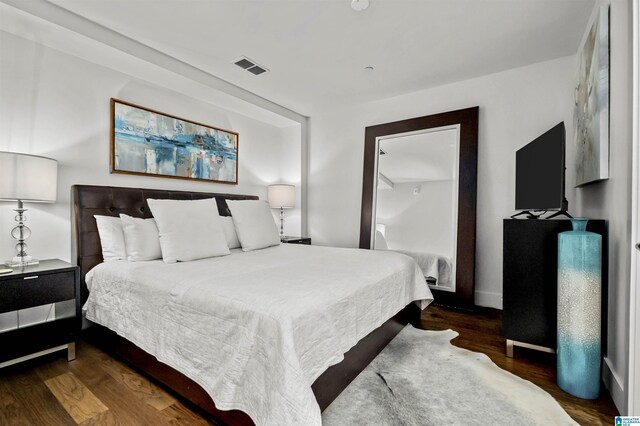 bedroom featuring dark wood-type flooring