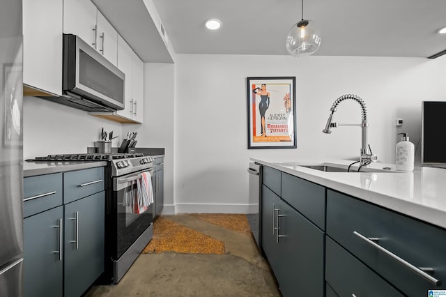 kitchen featuring pendant lighting, white cabinets, sink, gray cabinets, and stainless steel appliances