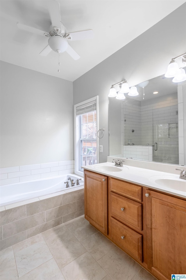 bathroom with tile patterned floors, plus walk in shower, vanity, and ceiling fan