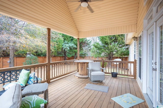 wooden terrace featuring ceiling fan