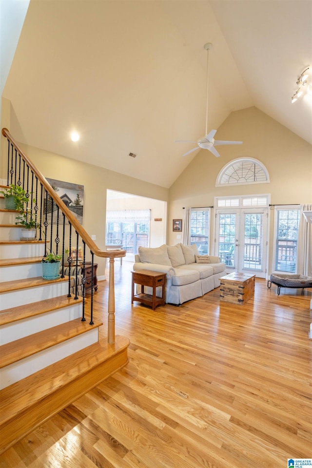 unfurnished living room featuring ceiling fan, plenty of natural light, and light hardwood / wood-style flooring