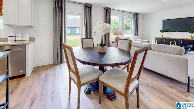 dining area featuring light wood-type flooring