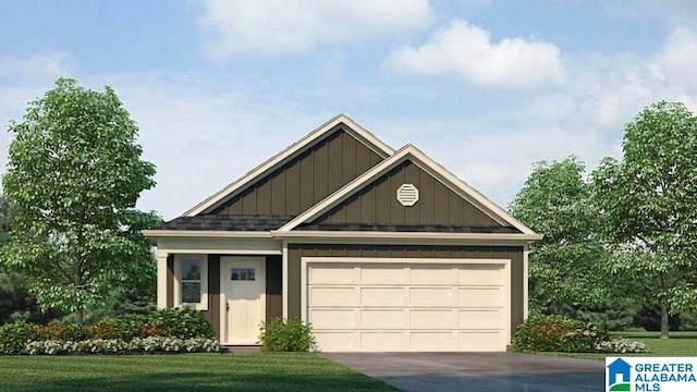 view of front of house with a front yard and a garage