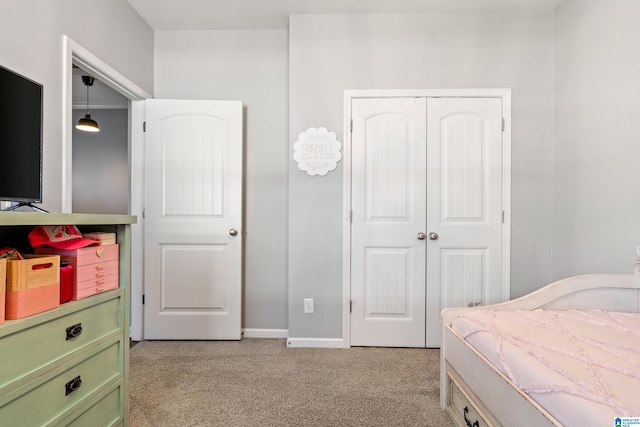 carpeted bedroom with a closet