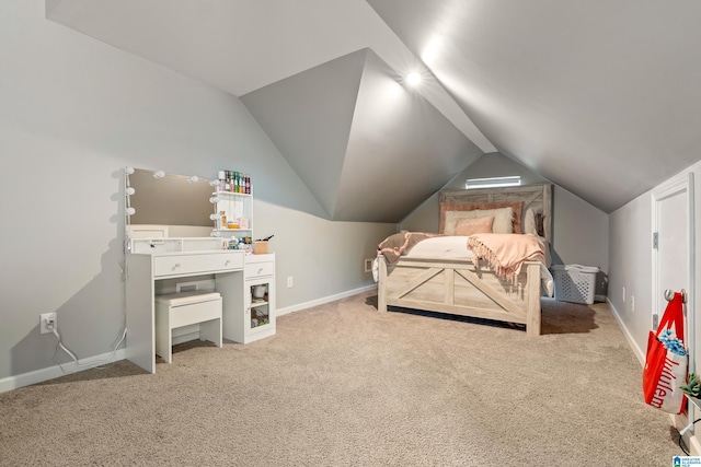 carpeted bedroom with vaulted ceiling