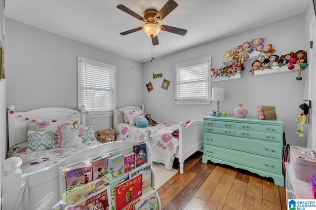 bedroom featuring ceiling fan and dark hardwood / wood-style floors