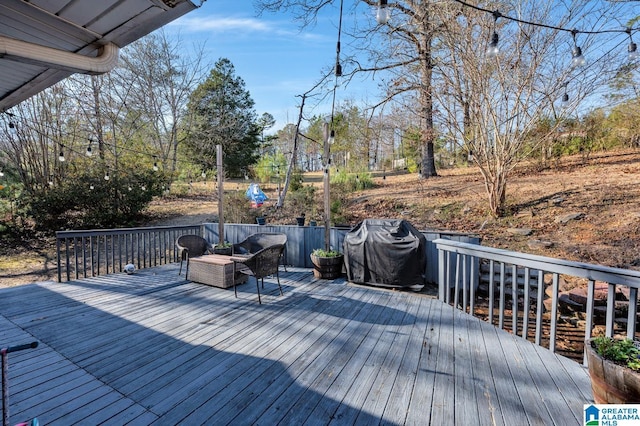 wooden deck with grilling area