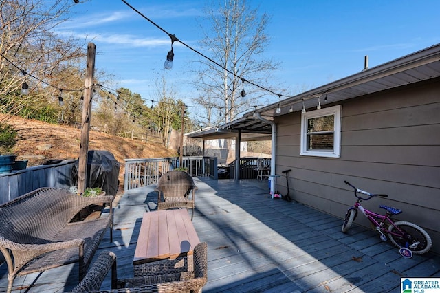 deck with area for grilling and an outdoor hangout area