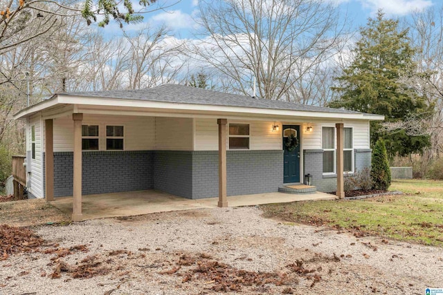 ranch-style house with a carport