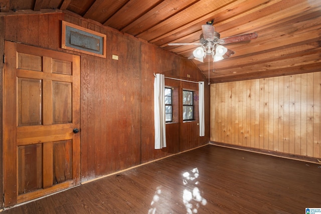 unfurnished room with wooden ceiling, wooden walls, vaulted ceiling, ceiling fan, and dark hardwood / wood-style flooring