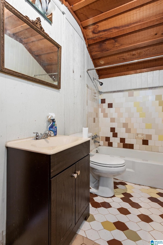 full bathroom featuring wood ceiling, vanity, toilet, tiled shower / bath, and lofted ceiling