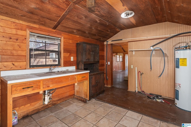 kitchen with sink, electric water heater, wooden walls, and wood ceiling