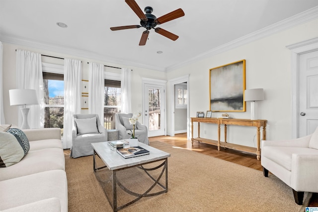 living room featuring ceiling fan and crown molding