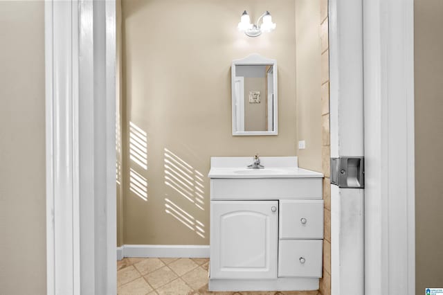 bathroom with tile patterned floors and vanity