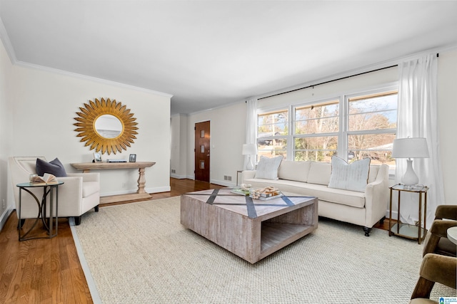 living room with wood-type flooring and crown molding