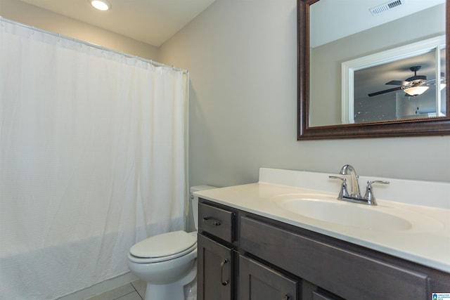 bathroom featuring tile patterned floors, ceiling fan, vanity, and toilet