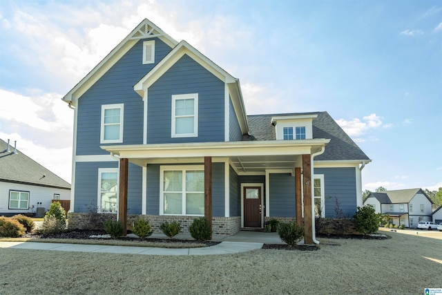 view of front of property with a porch and a front yard