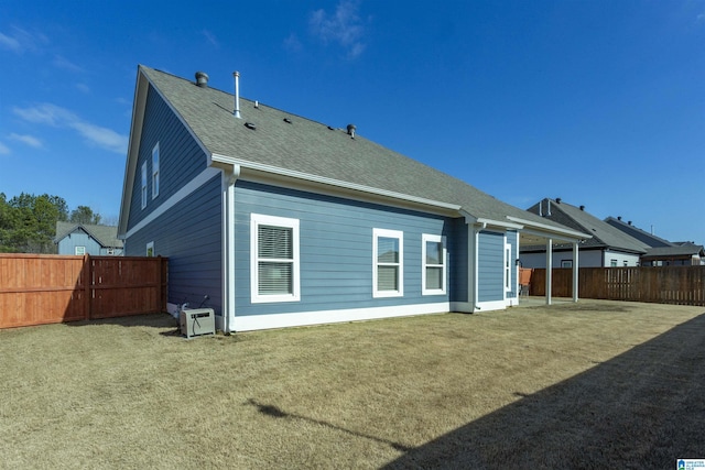 rear view of house with a lawn