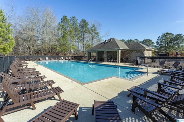 view of swimming pool featuring a patio area