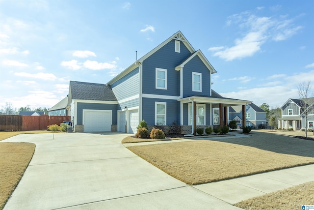 view of front of property with a porch and a garage