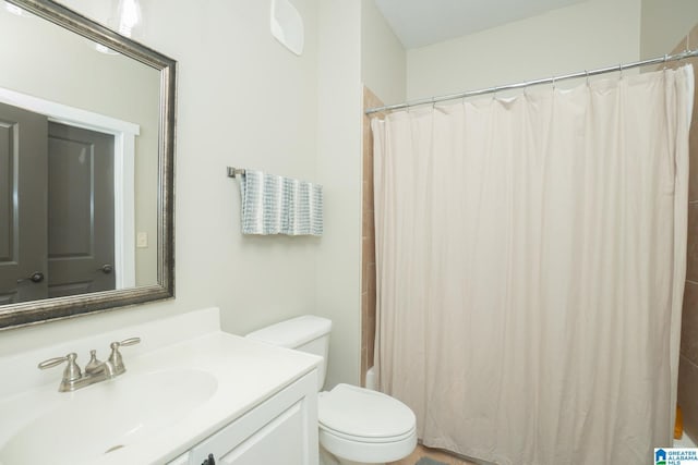 bathroom featuring vanity and toilet