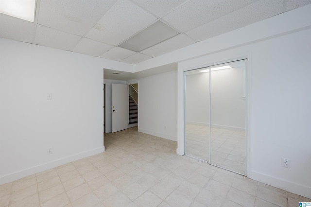 basement featuring a drop ceiling