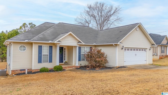 view of front of home with a front lawn and a garage