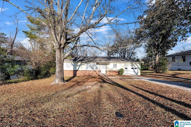 ranch-style house with concrete driveway