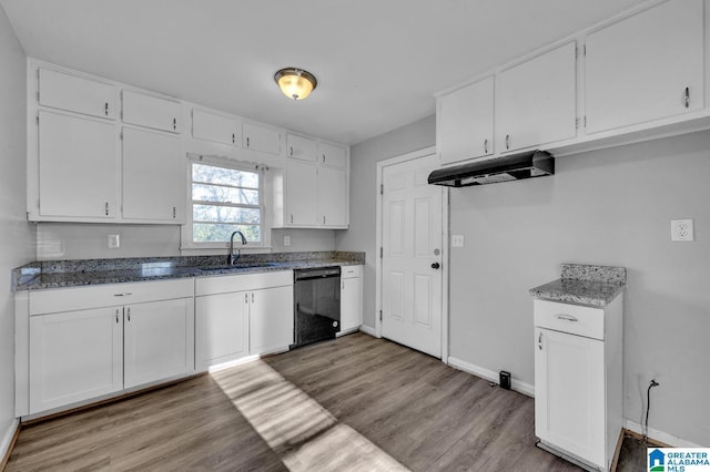 kitchen with sink, white cabinets, light wood-type flooring, and black dishwasher