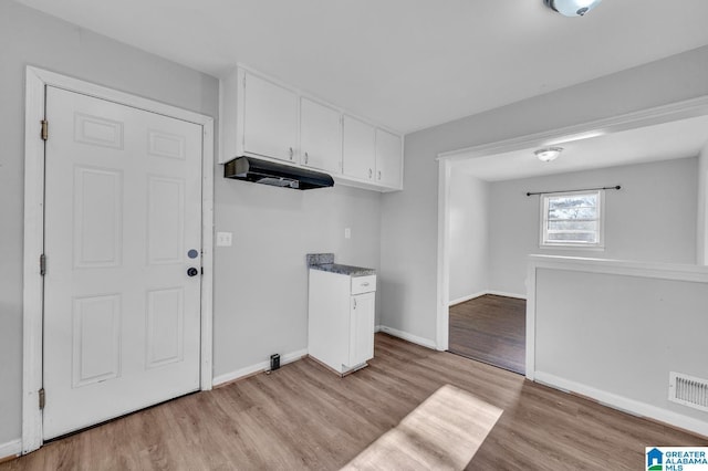 laundry area featuring light hardwood / wood-style floors