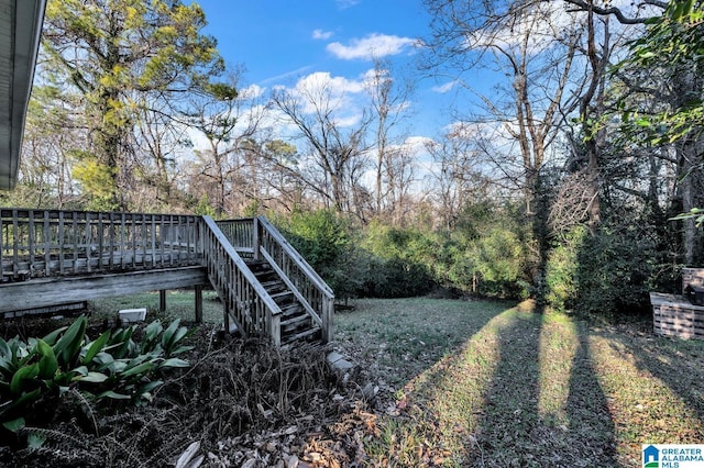 view of yard featuring a wooden deck